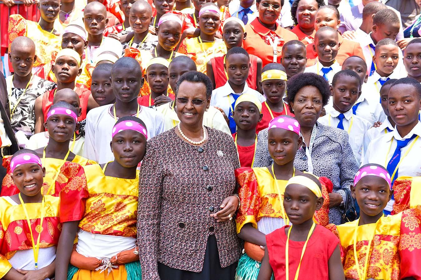 First Lady poses with children as she opened AEAA - Munyonyo